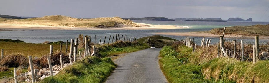 View of beach with Tory Island in the background